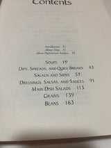 Contents page from Moosewood Restaurant Cooks at Home, listing sections like Soups, Salads, and Main Dishes, emphasizing quick recipes for everyday cooking.