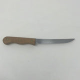 A close-up of the EKCO Forge Utility 6 Inch Knife with a wooden handle, ideal for slicing meat, fruit, and veggies.