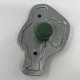 Mid century metal cookie cutter with green knob on surface.