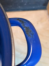 Marlboro Gear 6 quart stock pot showing chipped blue speckled enamel on handle, highlighting minor damage. Includes strainer and lid for versatile cooking.