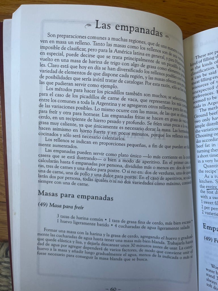 Open Así Cocinan los Argentinos / How Argentina Cooks cookbook, displaying text on Argentine cooking techniques and recipes.