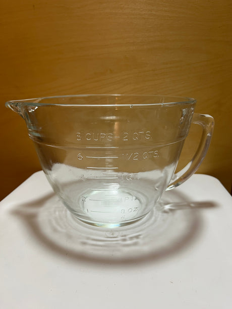 Anchor Hocking 8-cup glass measuring cup with handle, ideal for baking tasks like whipping aquaphaba or microwaving, ensuring easy maneuverability when full.