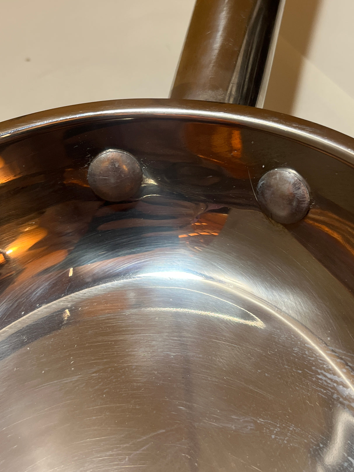 Wolfgang Puck Bistro Collection 18-10 stainless steel oval fish pan, showcasing its riveted handle connection, missing original glass lid.