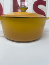 Yellow pot with lid, identified as Untitled Feb5_18:47, suitable for cooking and serving. Features a sleek, durable design ideal for kitchen use.