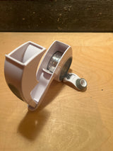 Rotary grater with two drums - Zyliss, showcasing its white plastic housing and visible metal roller mechanism, ideal for efficient cheese grating.