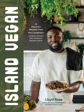 Cover of Island Vegan: 75 Caribbean Recipes From Jamaica & More by Lloyd Rose, featuring him in a kitchen with a plant-based dish, fruits, and greenery.