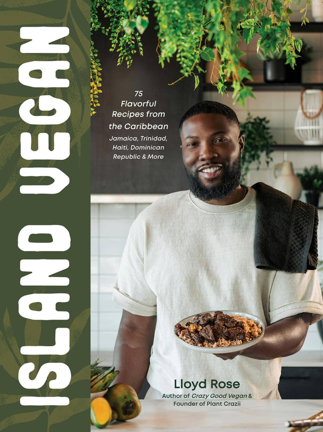 Cover of Island Vegan: 75 Caribbean Recipes From Jamaica & More by Lloyd Rose, featuring him in a kitchen with a plant-based dish, fruits, and greenery.