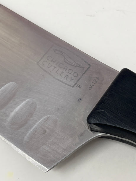 Chicago Cutlery 6” santoku knife, medium-sized, ideal for chopping crunchy produce like radishes, broccoli, and apples, an essential all-purpose kitchen tool.
