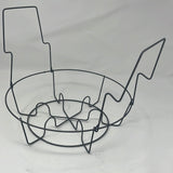 A wire basket resembling a music note and a figure, paired with a Century Ware stock pot with steamer basket, captured in a sketch-style drawing.