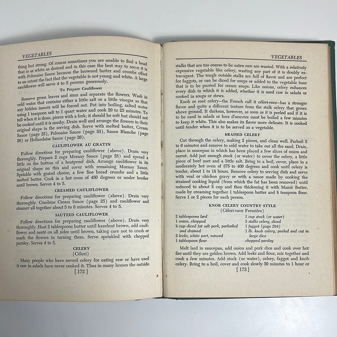 Louis Diat's Home Cookbook: French Cooking for Americans, featuring an open page with traditional French recipes, capturing rustic culinary traditions.