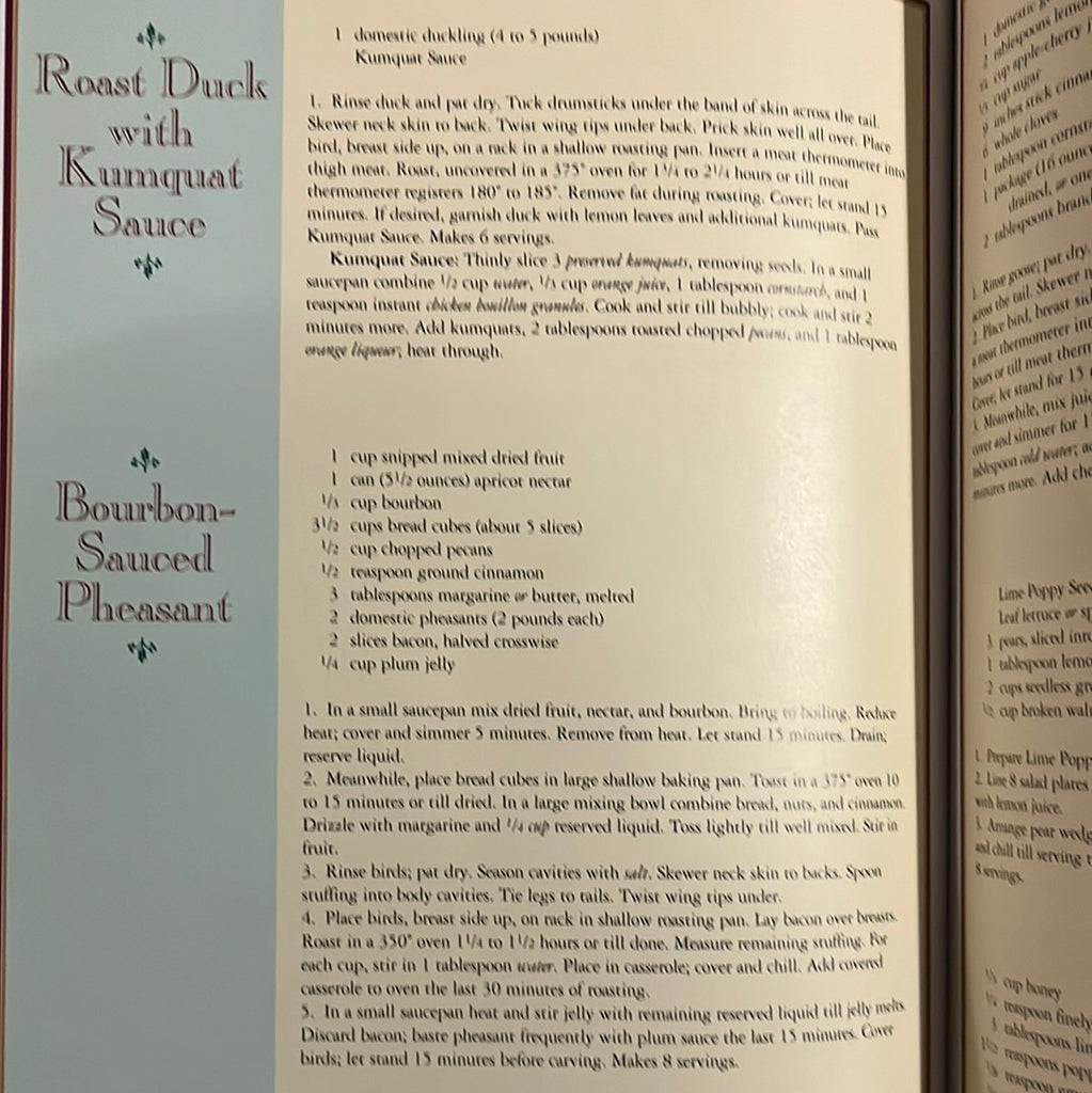 A close-up of A Festive Christmas recipe book with text and tablesetting ideas. Features recipes for roast duck with kumquat sauce, and bourbon-sauced pheasant. From Spoons Kitchen Exchange.