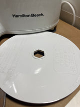 Hamilton Beach Chef Prep 70700 7-cup food processor with slicing/shredding disc, showing hex-shaped center hole and instructions; small chip on rim visible.