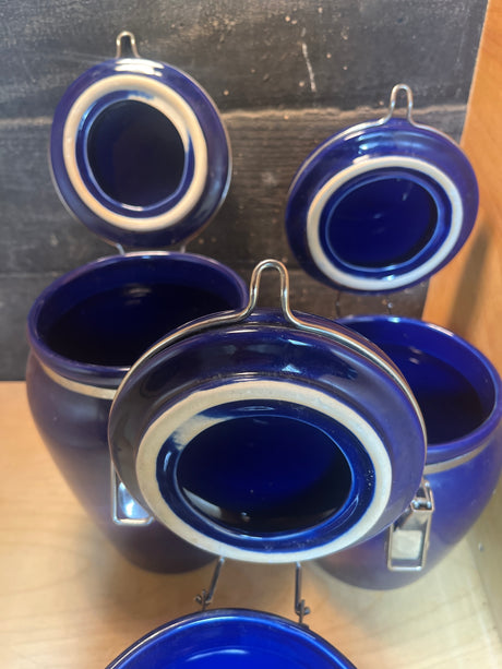 Set of 3 jars - cobalt blue ceramic with locking lids, featuring flip-up wire-bail clasps, ideal for storing coffee, tea, and dry goods on your countertop.