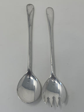 Italian silver plated salad tongs with a minimalist design, showing some tarnish from normal use, displayed on a white surface.