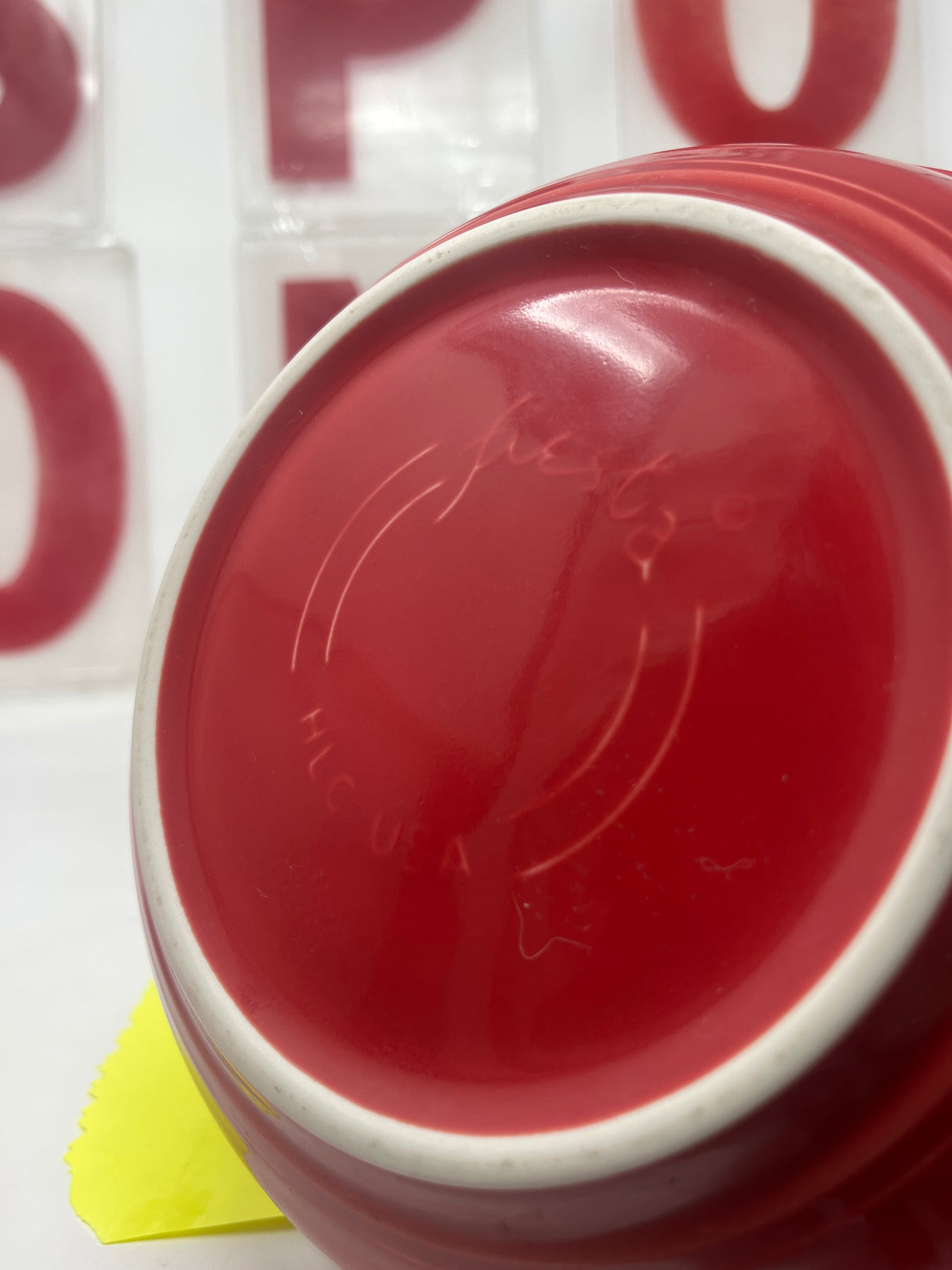 Fiestaware by Homer Laughlin scarlet red ceramic bowls, featuring a large deep bowl and a smaller vintage bowl, showcasing durable and stylish design.