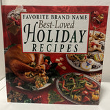 Favorite Brand Name Best-Loved Holiday Recipes book featuring a food-themed cover, emphasizing holiday culinary traditions and cherished recipes from top brands.