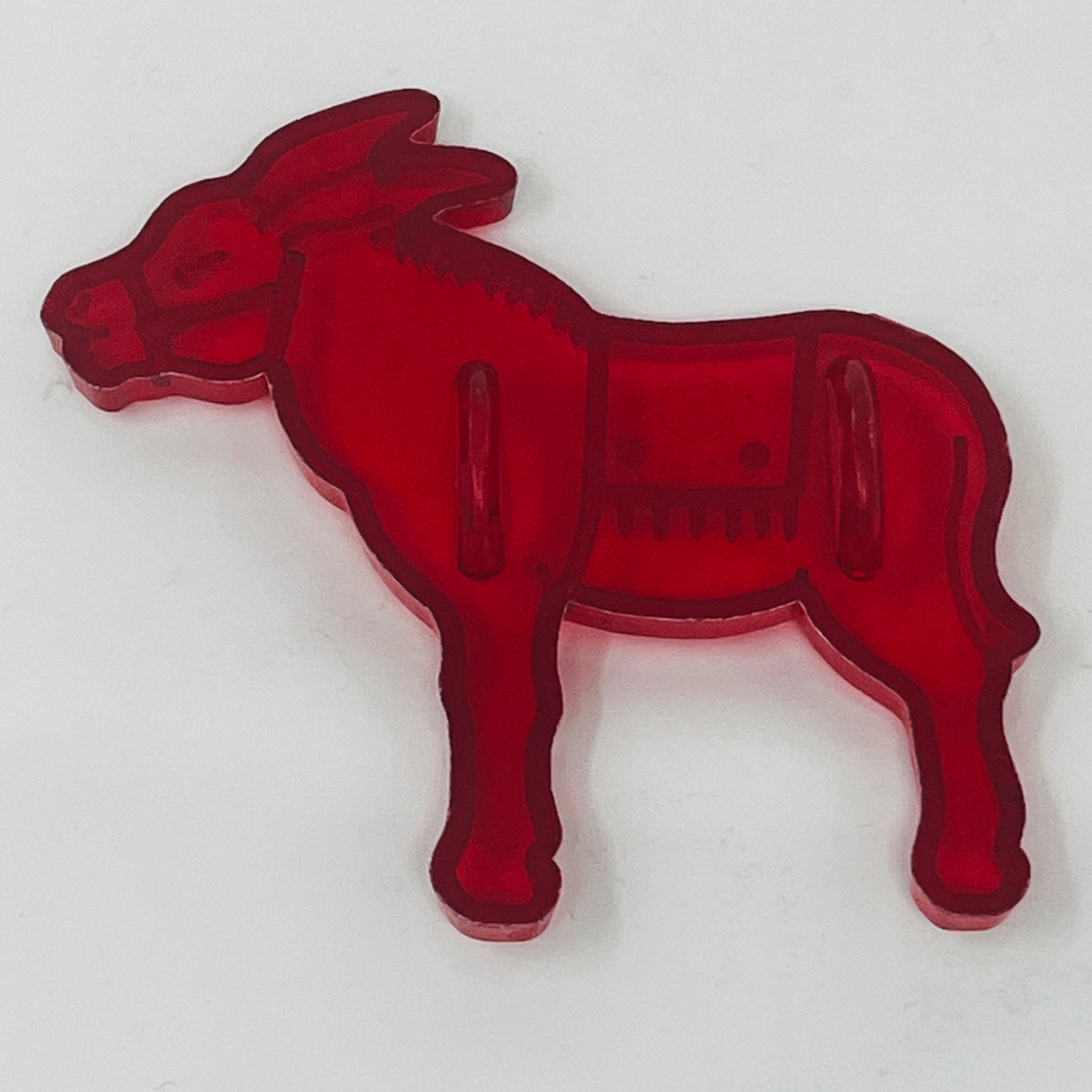 Red plastic mid century cookie cutters featuring animal figures, including a donkey.