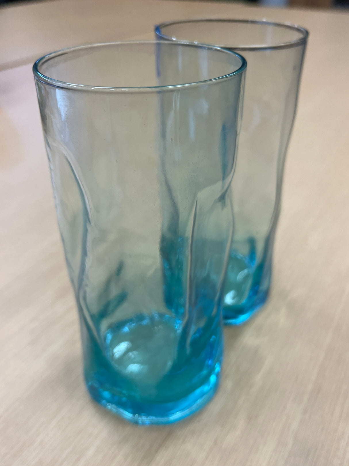 Bormili highball glass, featuring a sleek, transparent design, ideal for serving beverages. Its smooth surface and elegant shape make it a sophisticated drinkware choice.