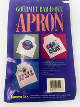 A white apron with colorful letters and a logo, packaged in blue with apron images. Let's Eat! Gourmet Bar-B-Que Apron, never worn.