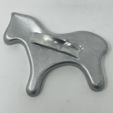 Mid century metal cookie cutter of a horse on white surface. From Spoons Kitchen Exchange. 