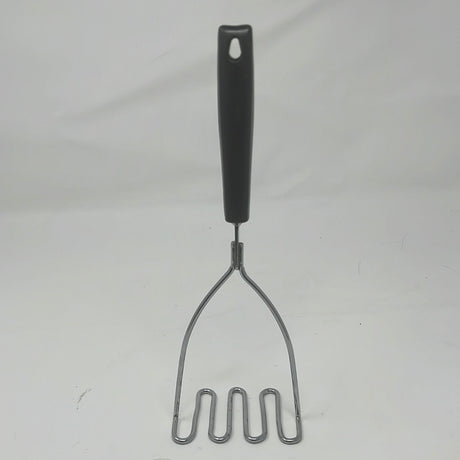 Potato masher with black handle, sturdy steel component for efficient potato mashing.