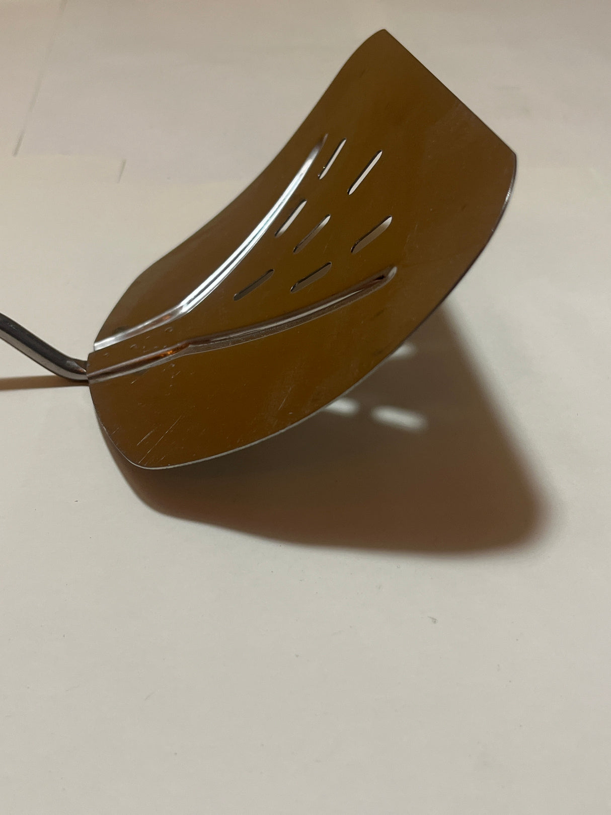 Foley Stainless Steel Wide Slotted Turner Lifter MPLS Curved Spatula, featuring a thin, sturdy metal blade and a like-new resin handle for flipping foods effortlessly.