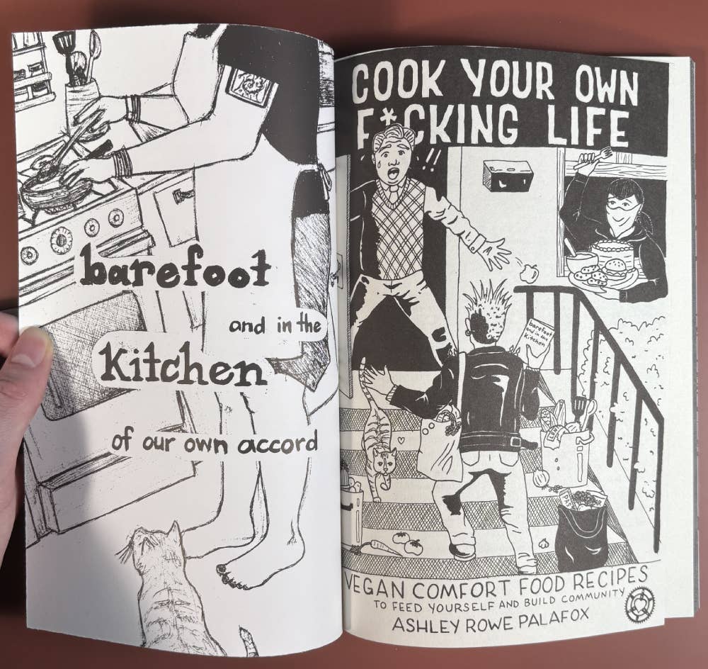Two-page spread of Cook Your Own Fucking Life, featuring hand-drawn sketches and punk-style cover art, highlighting DIY vegan comfort food by Ashley Rowe Palafox.