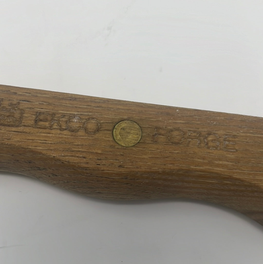 A wooden handle with a screw holds the EKCO Forge Utility 6 Inch Knife, ideal for precise slicing of meat, fruit, and veggies.