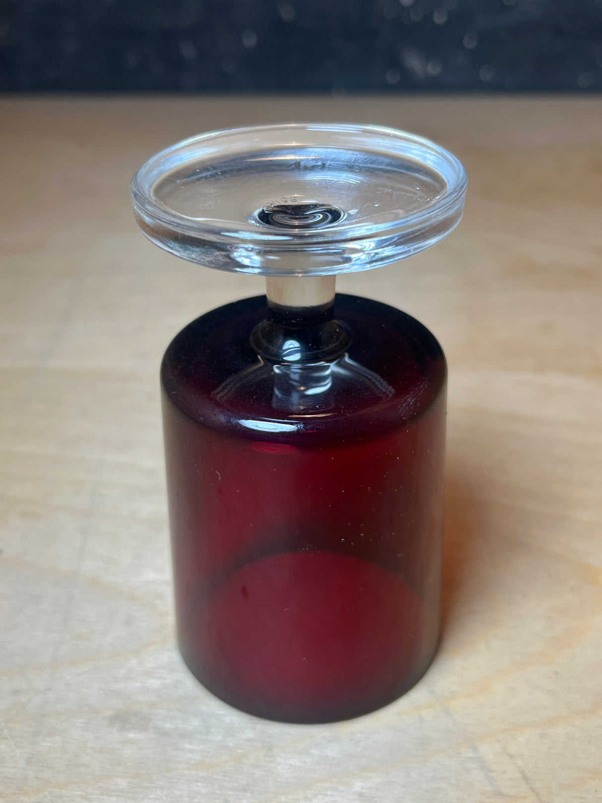 Luminarc/ARCOROC ruby red small wine glass with a clear-glass stem and lid, resembling a pedestal or votive holder, crafted from two glass pieces.