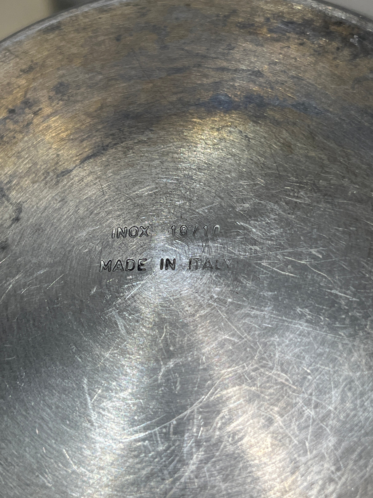 Underside view of VEV Vigano Carioca 6-cup stainless steel stovetop espresso pot, stamped with “INOX 18/10” and “MADE IN ITALY.”