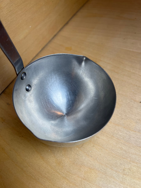 Ladle - stainless steel with wood handle - vintage Robinson, features a riveted shallow bowl and short handle with hanging hole, ideal for controlled serving.