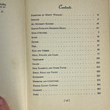 Louis Diat's Home Cookbook: French Cooking for Americans, featuring recipes from the French countryside, is shown open with visible handwritten notes.