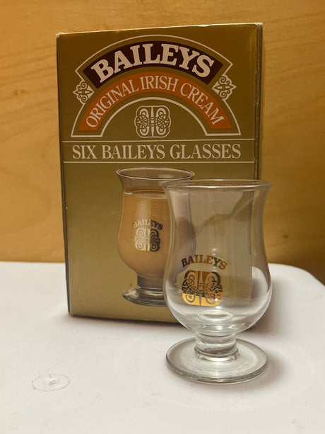Set of 6 Baileys glasses neatly arranged, highlighting their sleek design and uniform shape, ideal for serving Baileys or similar beverages.