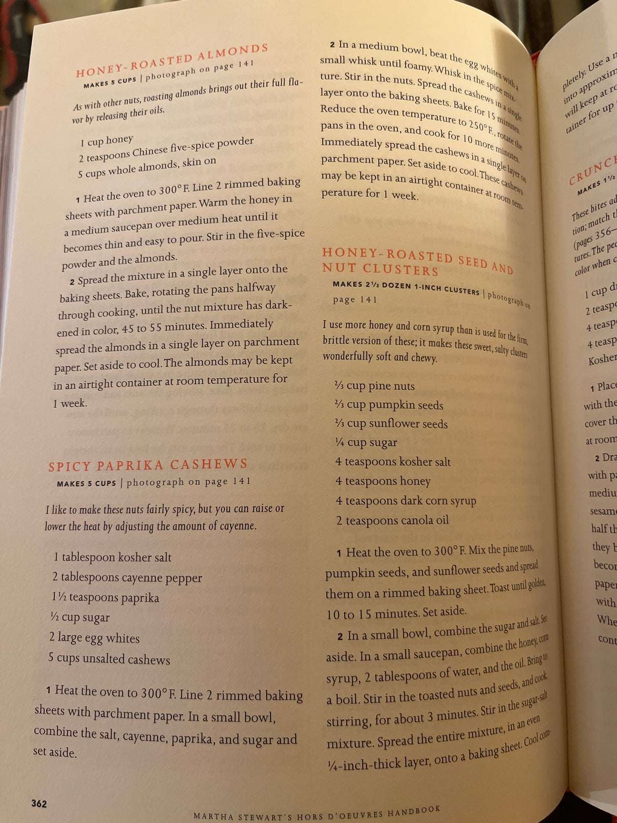Cookbook page from Martha Stewart’s Hors d’Oeuvres Handbook, featuring recipes for Honey-Roasted Almonds, Spicy Paprika Cashews, and Honey-Roasted Seed and Nut Clusters with detailed instructions.