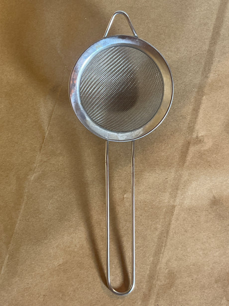 Stainless steel mesh strainer with loop handle, 2.5 inch, ideal for sifting and straining. Features a hanging ear for convenient cup or bowl placement.