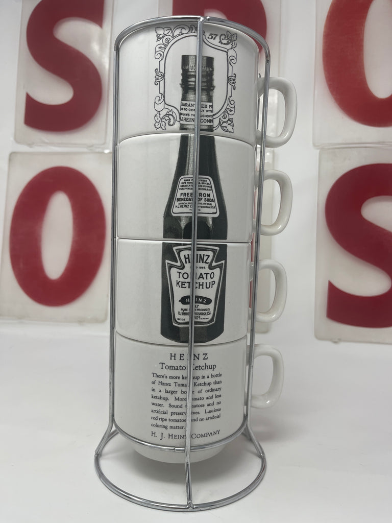 Heinz 57 Ketchup stacking ceramic coffee mugs set of 4 in a stainless steel holder, perfect collectible in excellent condition.