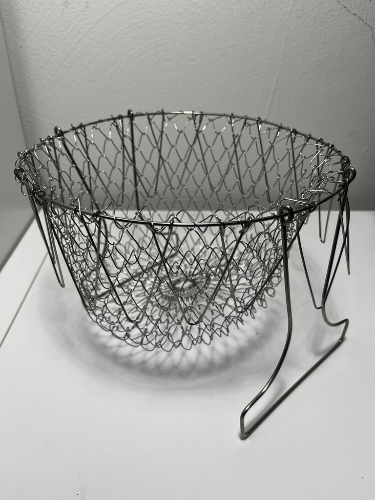 Stainless Steel Foldable Basket Strainer for Frying and Steaming Food, a versatile wire mesh tool for cooking and storage.
