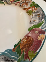 Jungle Fever dinner plate - Sango 3033 designed by Deborah Mallow, featuring a macaw, hippo, tiger, and elephant motifs on the rim.