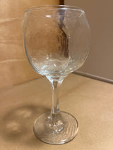 Libbey Chivalry glassware featuring a hammered-texture bowl, elegantly displayed upright on a countertop, showcasing its unique design and craftsmanship.