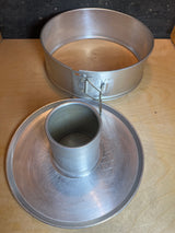 Springform 3-piece angel food cake pan - vintage Manitowoc aluminum, showing the outer ring with latch and base with central hollow tube for tube-style cakes.