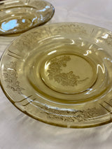 Close-up of the 1930s Federal Glass Amber Sharon/Cabbage Rose fruit bowl, showcasing its embossed floral details on light yellow-tinted glass, in excellent vintage condition.