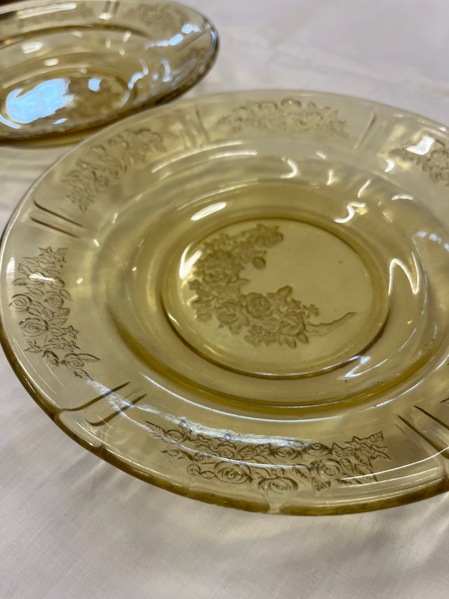 Close-up of the 1930s Federal Glass Amber Sharon/Cabbage Rose fruit bowl, showcasing its embossed floral details on light yellow-tinted glass, in excellent vintage condition.