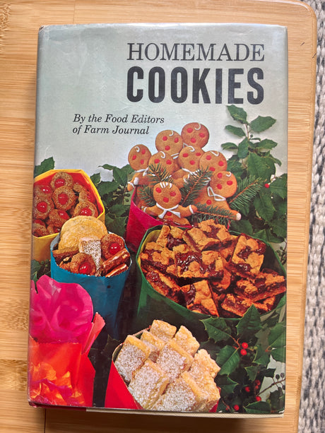 Homemade Cookies by the Food Editors of Farm Journal on a table, showcasing a cookbook with over 460 cookie recipes, including classic and unique options.