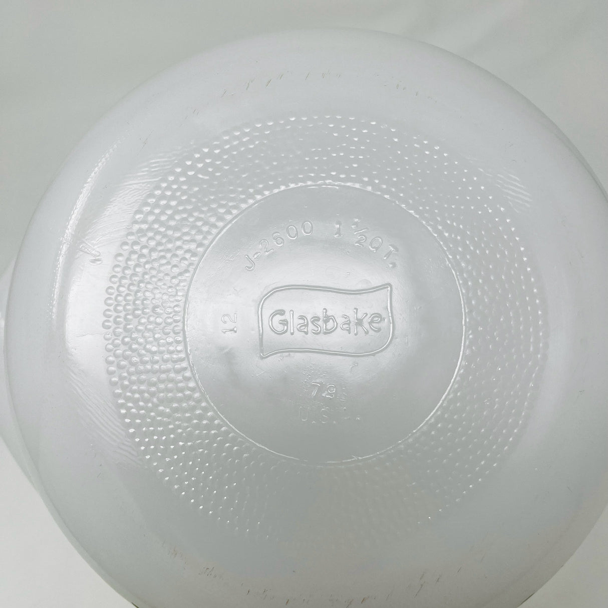 Glasbake casserole dish underside showing engraved logo. From Spoons Kitchen Exchange. 