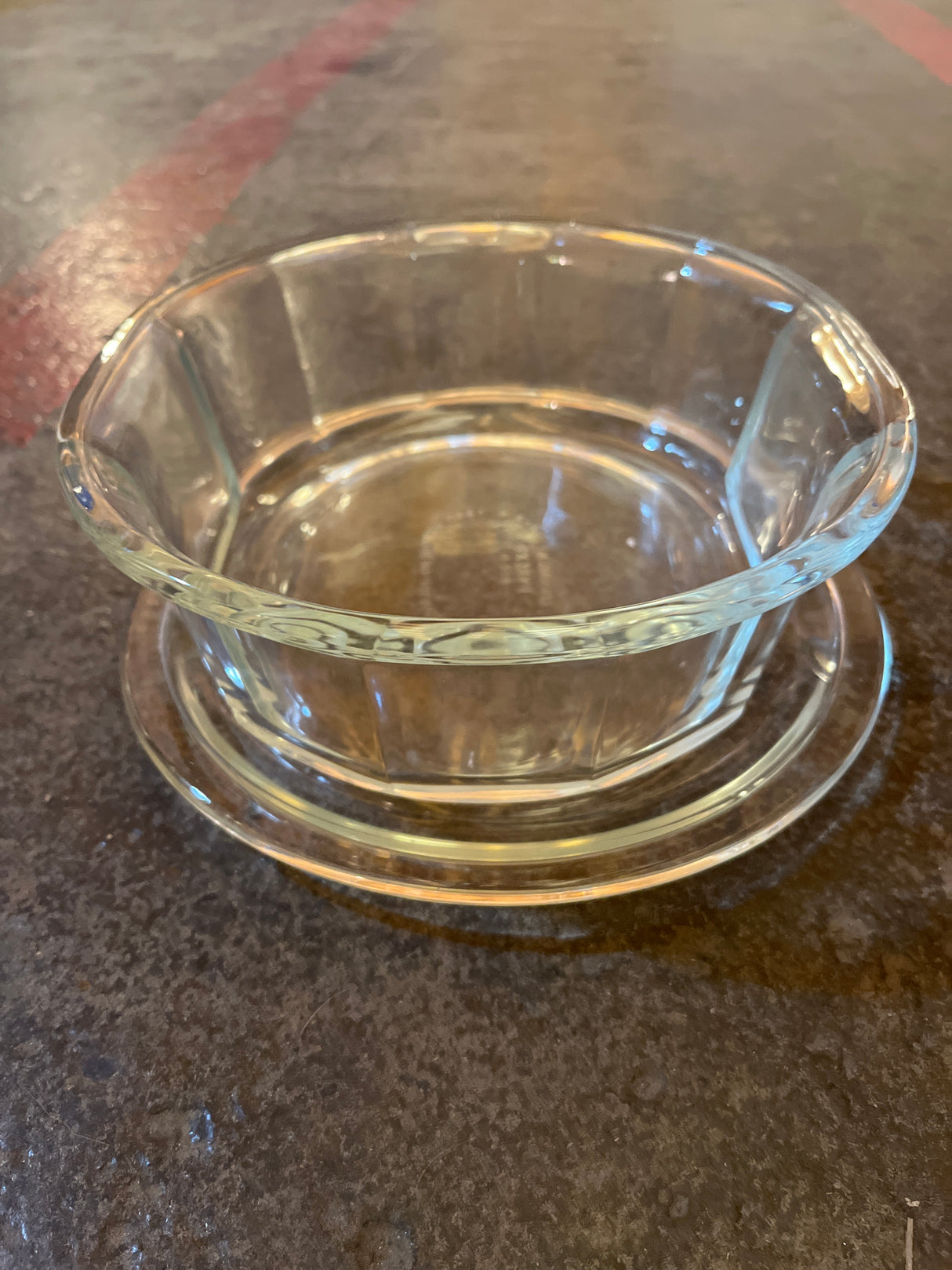 Oval casserole baking dish with lid - PYREX 804-B, showcasing an octagonal clear glass design on a matching saucer, emphasizing its durable borosilicate glass construction.