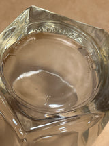 Bottom-up view of a Libbey Duratuff pentagonal whiskey tumbler glass, showing molded lettering around the rim and an embossed 7 at the center.