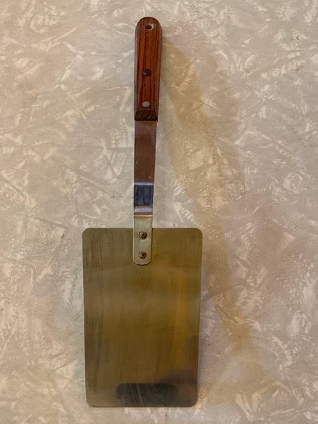 Flat thin steel spatula with wood handle - vintage, featuring a stainless steel blade and angled wooden handle, ideal for flipping pancakes and grilling veggie burgers.