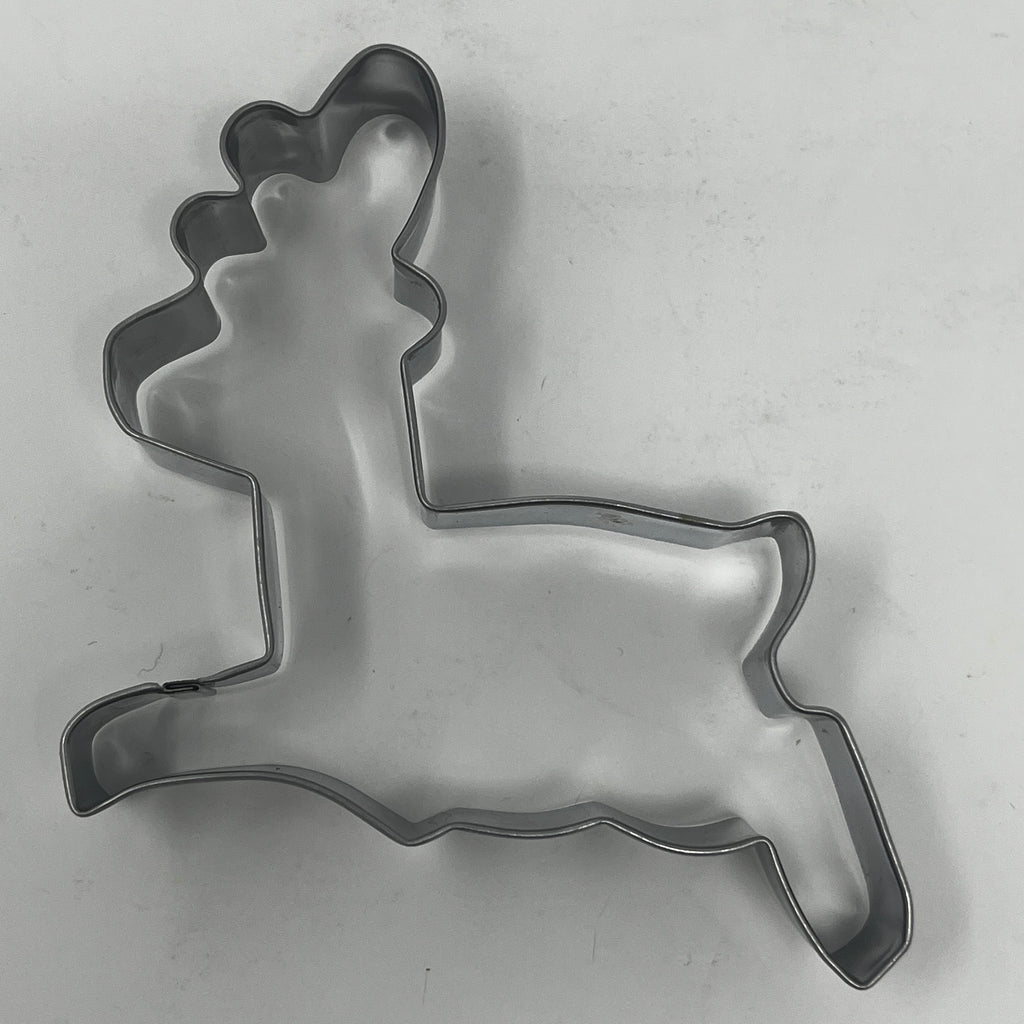 Mid century metal cookie cutters in deer and reindeer shapes, part of a collection featuring various holiday and celestial designs.