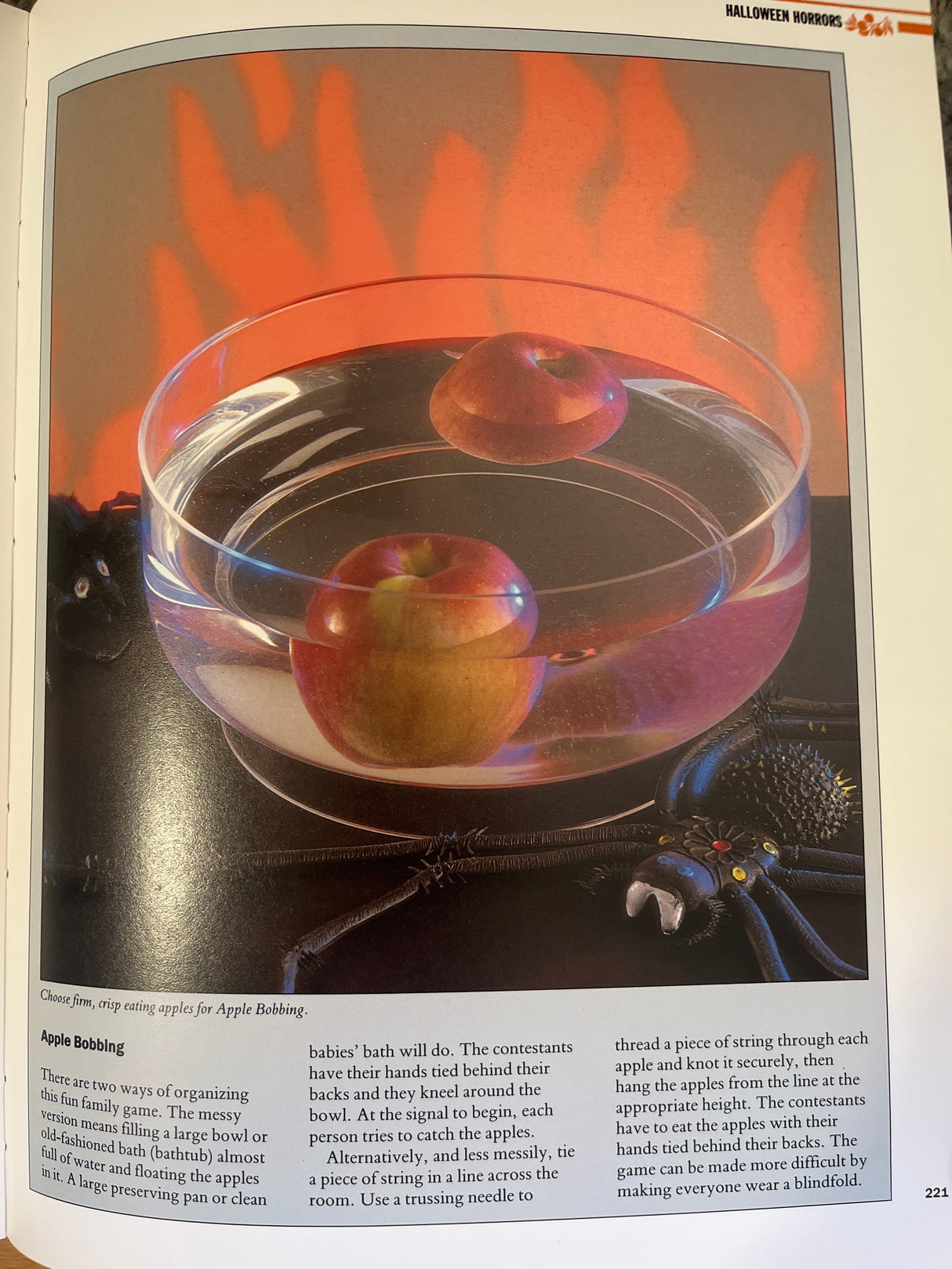 The Essential Guide to Entertaining by Bridget Jones book cover, featuring a glass bowl with apples, aligning with its theme of hosting and decorative ideas.