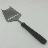 WMF vintage cheese slicer with black handle, a sharp blade and two prongs for easy cheese slicing.